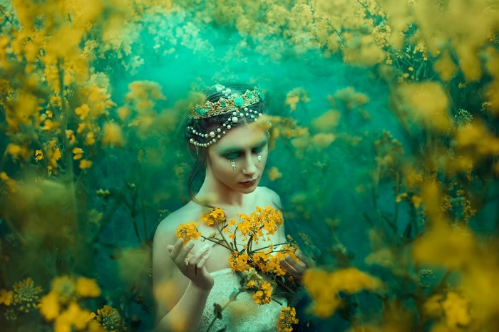 Woman with crown and yellow flowers