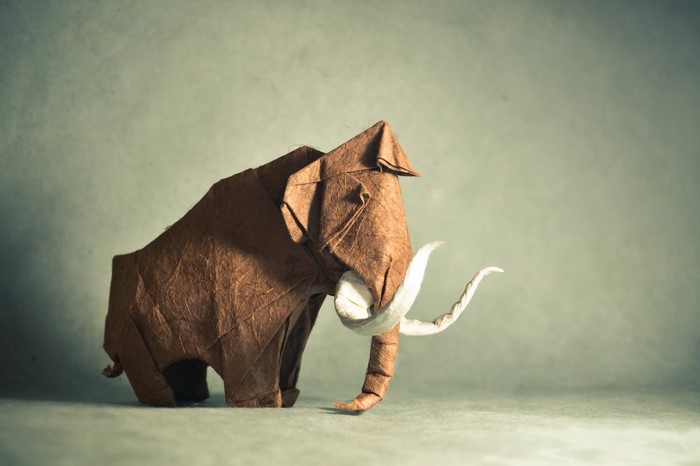 Origami mammoth made of brown paper