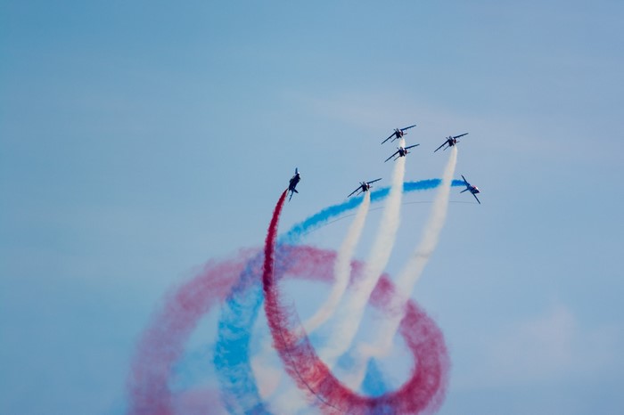 Patrouille de France Alpha Jets performing aerobatics with smoke trails