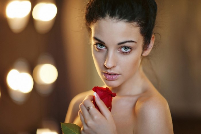 Woman holding a red rose, Alla Berger
