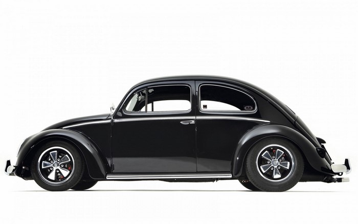 Black Volkswagen Beetle with custom wheels