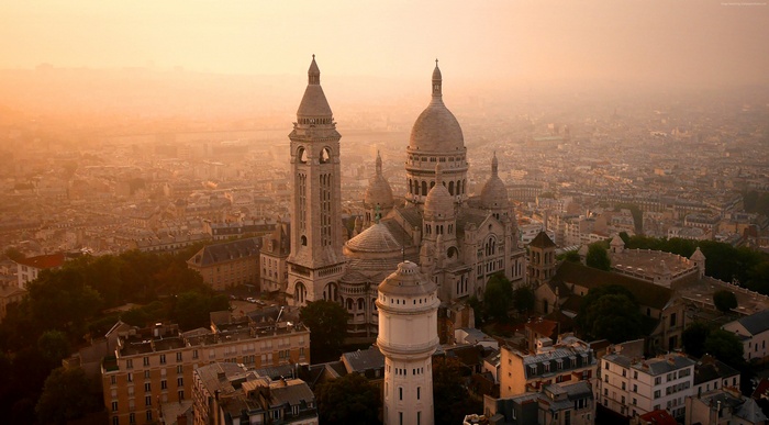 Sacre-Cœur Basilica and Paris cityscape at sunrise