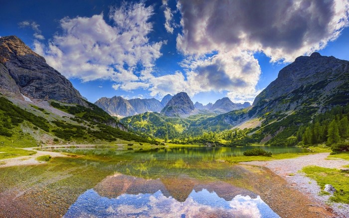 Morning Reflection Over a Serene Mountain Lake in Germany