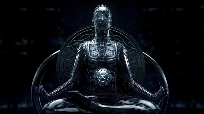 Monochrome robot meditating in a dark setting