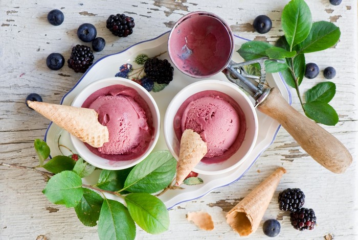 Berry ice cream with cones and berries