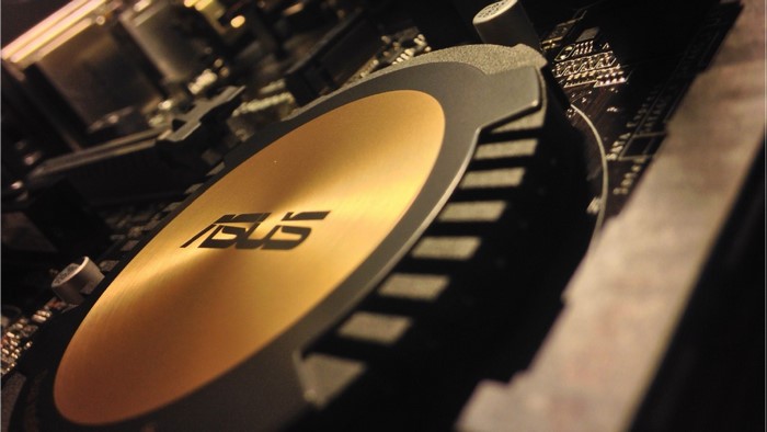 ASUS motherboard close up with gold heatsink