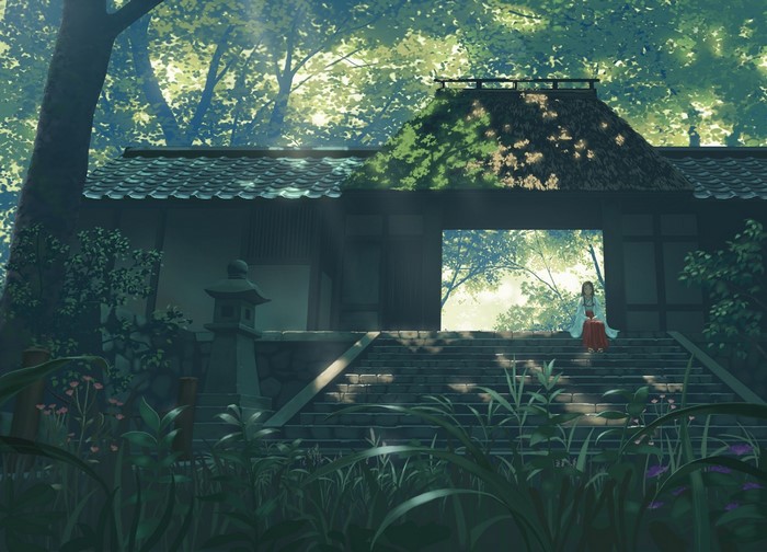 Girl in traditional Japanese clothing at a shrine in a forest