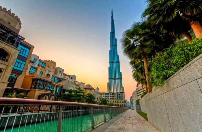 Burj Khalifa skyscraper and buildings along waterway in Dubai