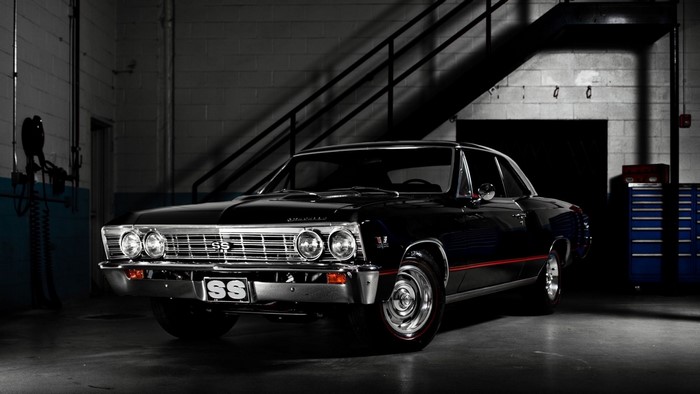 Black Chevrolet Chevelle SS muscle car in garage