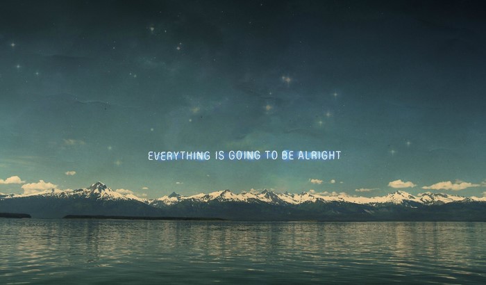 Mountains over water with text