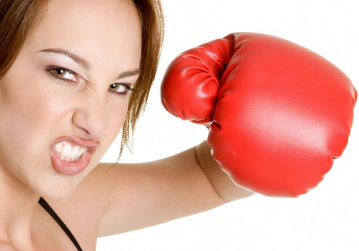 Woman wearing a red boxing glove