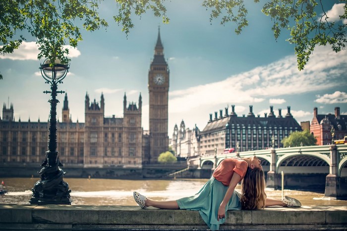 Woman doing splits in front of Big Ben, London