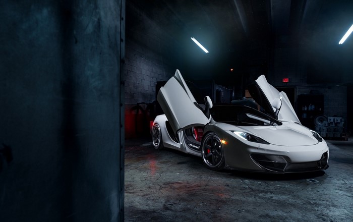 White McLaren MP4-12C with doors open