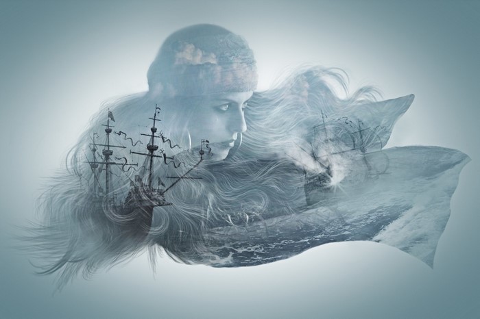 Double exposure of a woman and sailing ships