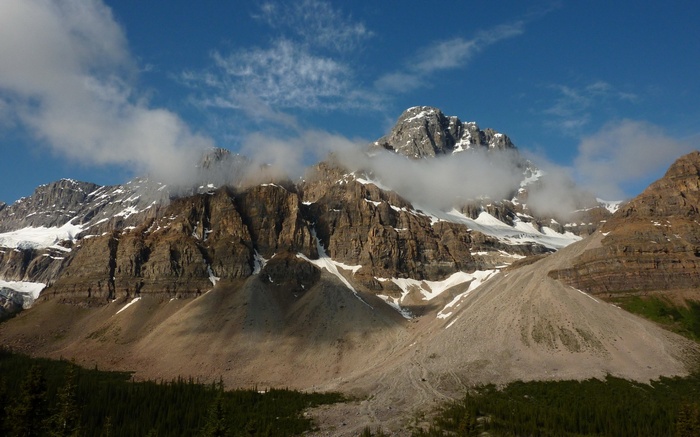 Rocky Mountains with clouds and snow