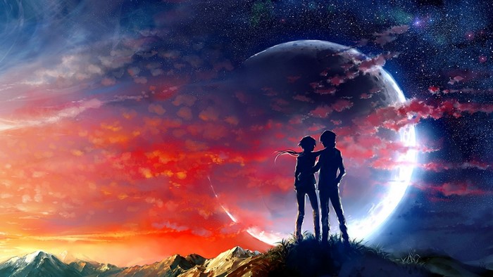 Couple watching a large moon and a meteor shower