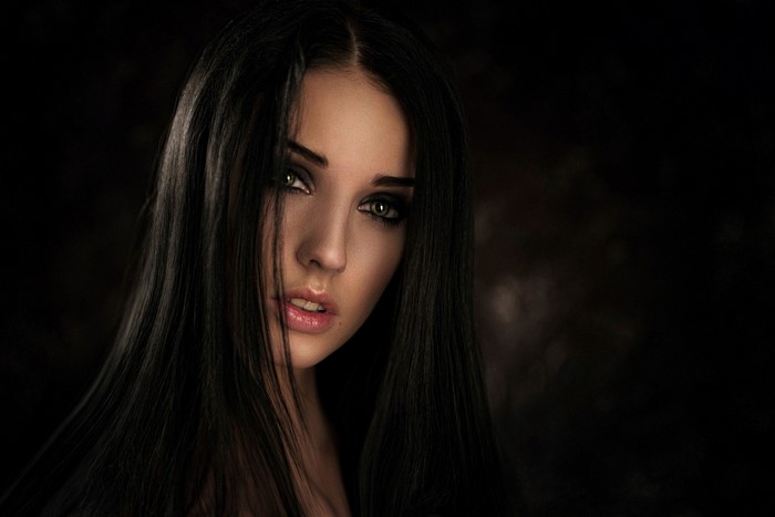 Portrait of a woman with long black hair