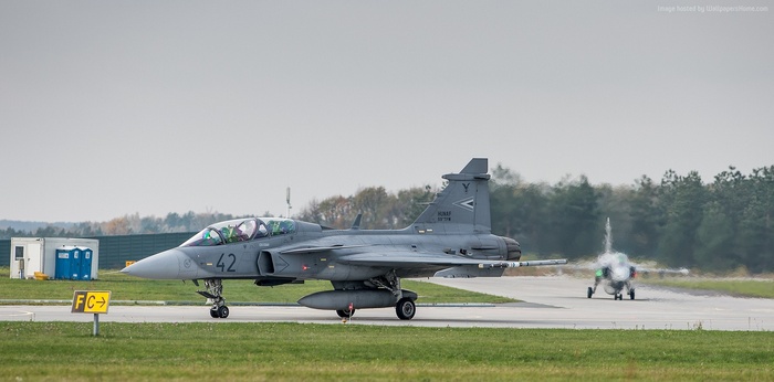Two JAS 39D Gripen fighter jets on a runway
