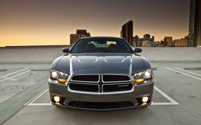 Gray Dodge Charger R/T parked in a city parking lot