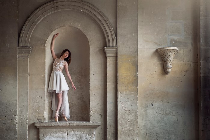 Ballerina in a stone archway