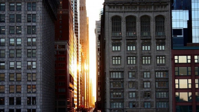 Sunlight between skyscrapers in a city