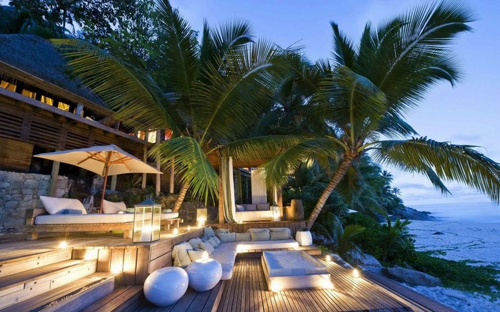 Tropical Beach Resort with Palm Trees at Sunset