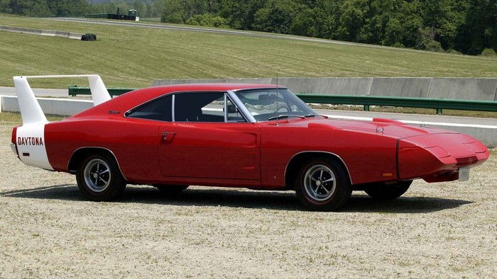 Red 1969 Dodge Charger Daytona on a Racetrack