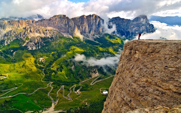Stunning Alpine Cliff Overlooking Winding Mountain Road in Italy