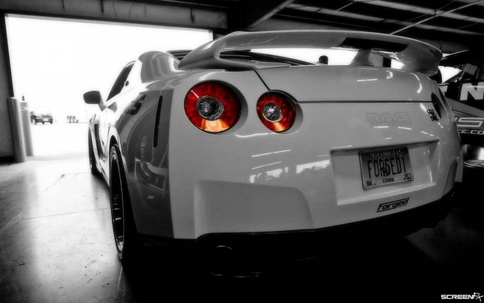 White Nissan GT-R with custom license plate