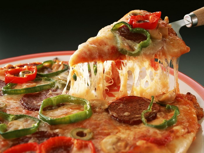Delicious Cheese and Pepperoni Pizza Slice with Veggies
