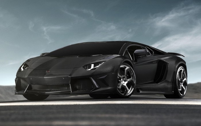 Black Lamborghini Aventador SVJ on a road