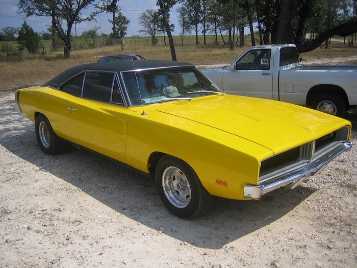 Yellow Dodge Charger parked outdoors