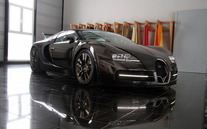 Black Bugatti Veyron parked in a garage