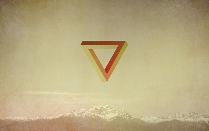 Impossible triangle over snowy mountains