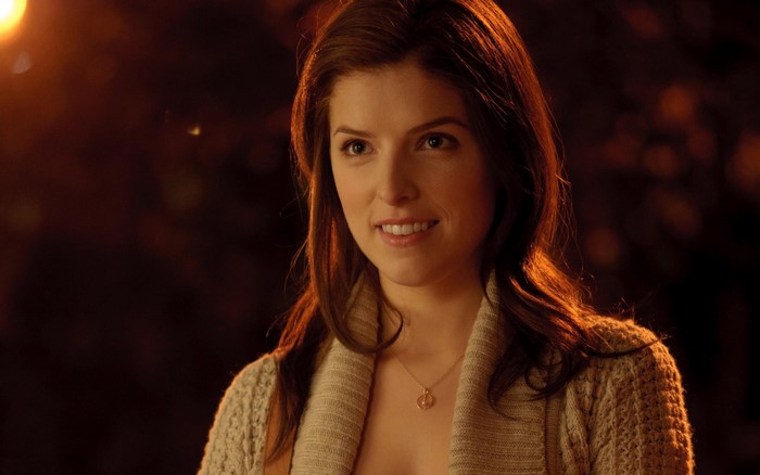 Anna Kendrick wearing a cardigan and necklace