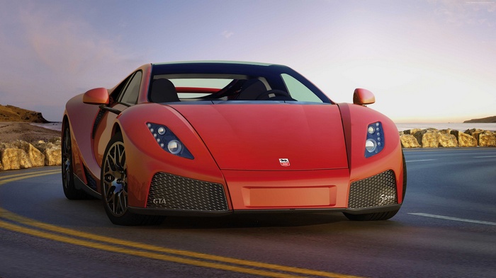 Red GTA Spano supercar on a coastal road
