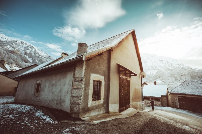 Snowy village with mountains and houses