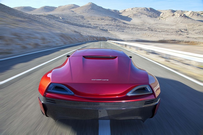 Rimac Concept One red electric hypercar driving on desert road