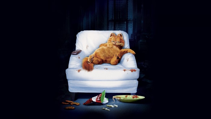 Garfield on a couch with snacks