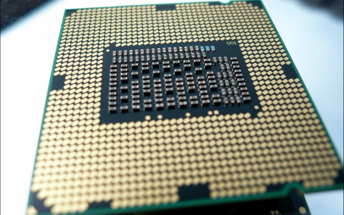 Close-up of a computer CPU with gold pins