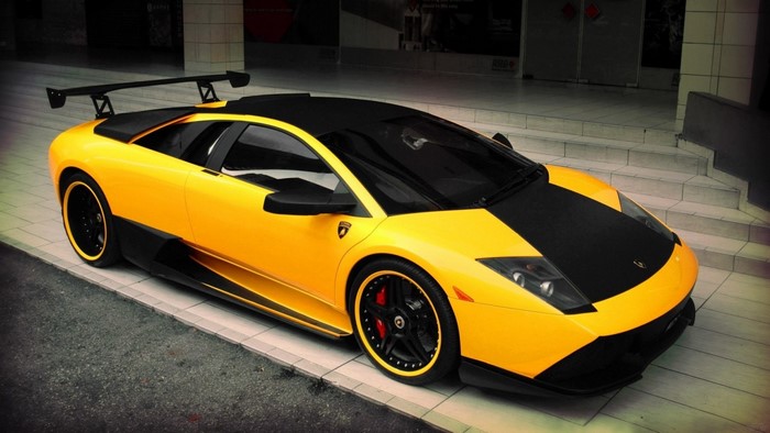 Yellow and black Lamborghini Murcielago with a large rear spoiler