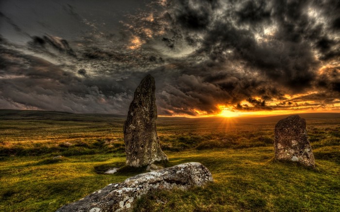 Sunset Over Rolling Hills with Standing Rocks