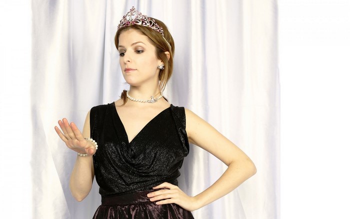 Anna Kendrick wearing a tiara and black dress