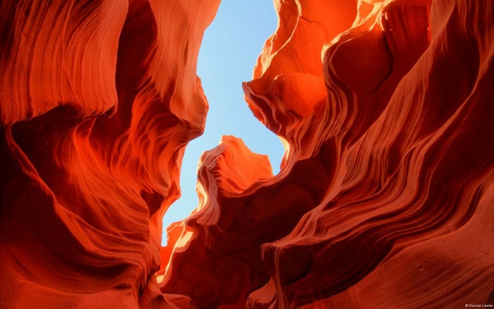 Antelope Canyon rock formations under blue sky