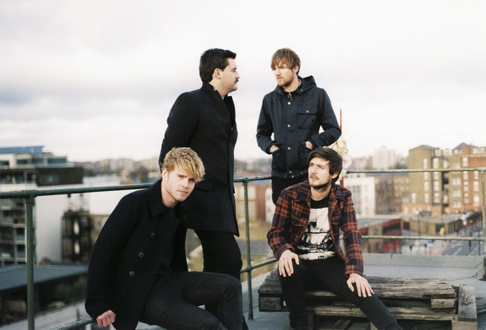 Kodaline band members on a rooftop