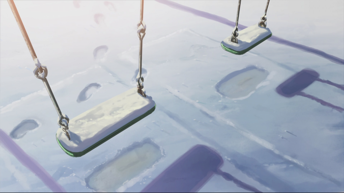 Swings covered in snow in a park
