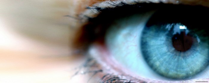 Close-up of a blue eye with eyelashes