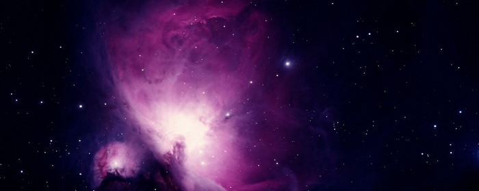 Purple and white nebula with stars in outer space