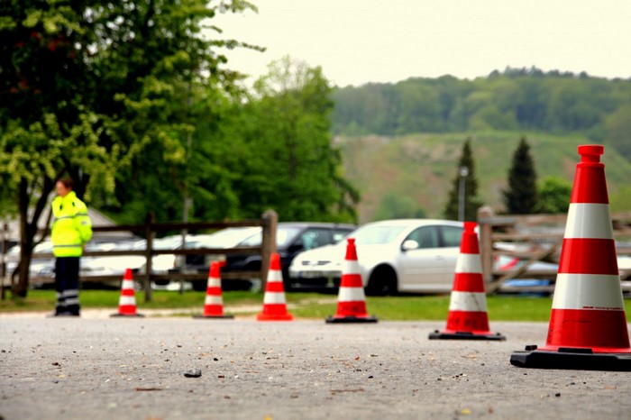 Traffic cones and a person in a safety vest