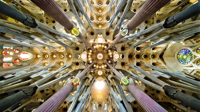 Interior view of Sagrada Familia with columns and stained glass windows